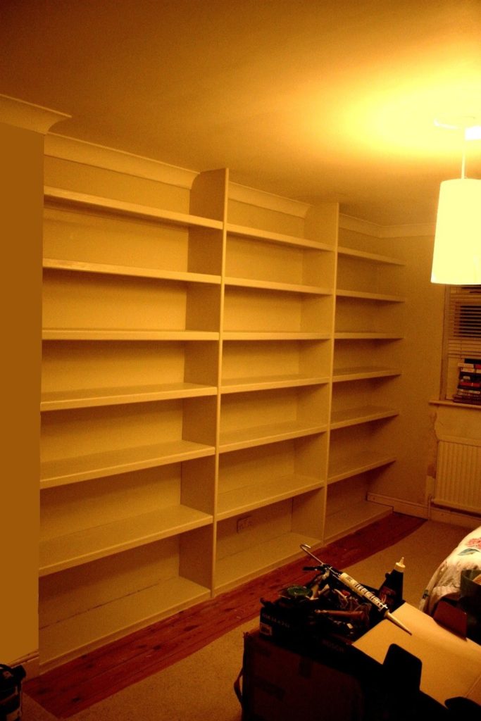 A pine built in bookcase / shelves 