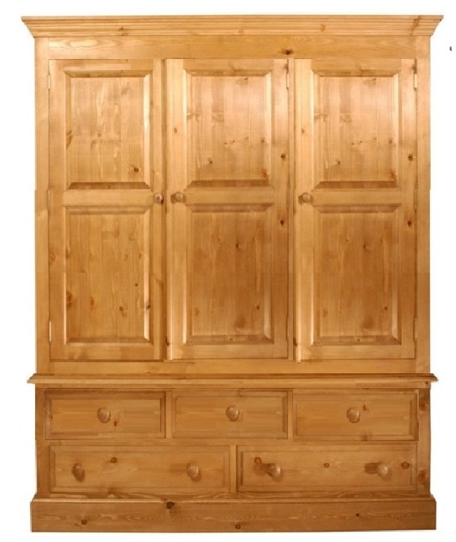 a pine wardrobe on a bank of five drawers which is 60 inches long