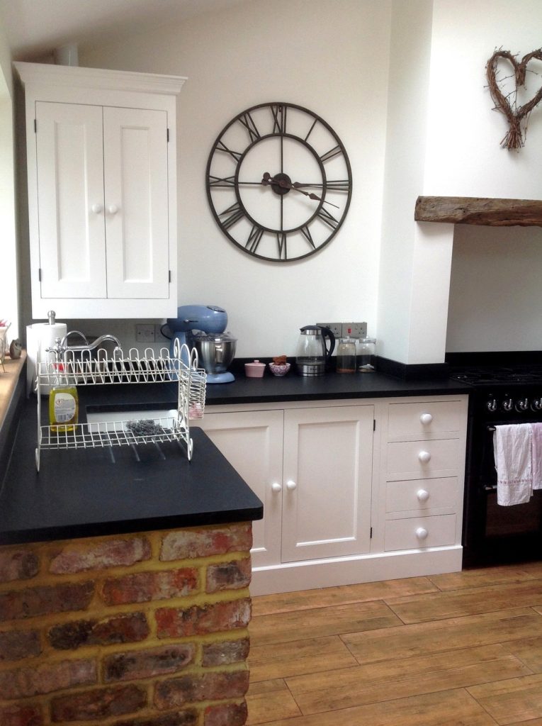 a painted solid wood kitchen painted white